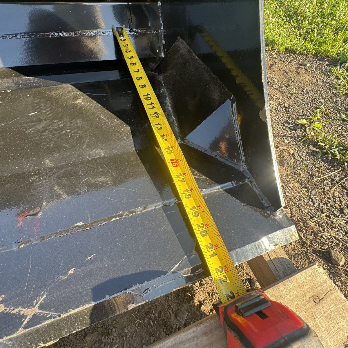 Tape measure showing bucket depth front to back