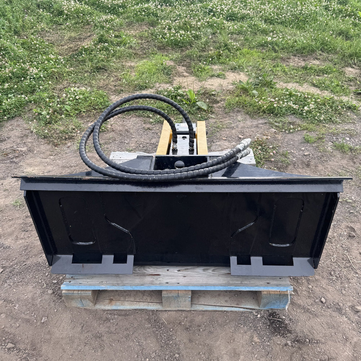 Concrete breaker viewed from the front showing universal quick attach mount plate