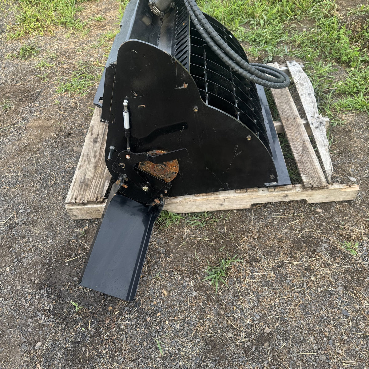 Pour chute swung open on the mixer bucket